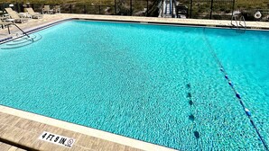 A swimming pool with a clear view of the ocean and a pier in the background. - Ocean Front Amelia Island, Beachfront Pool, 20% Off Sunglasses at Eye Envy store (Fernandina Beach)
