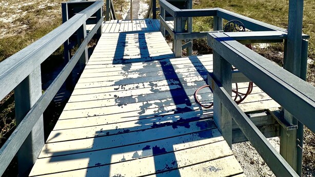 A wooden boardwalk leading to a beach with a clear blue sky. - Ocean Front Amelia Island, Beachfront Pool, 20% Off Sunglasses at Eye Envy store (Fernandina Beach)