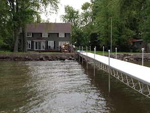 Stroll across the picturesque bridge to a serene riverside retreat.