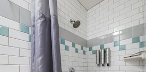Shower, hair dryer, towels, shampoo
