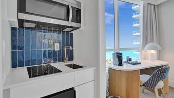 Fridge, microwave, stovetop, coffee/tea maker