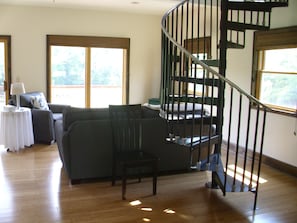 The living room with doors leading to the deck.