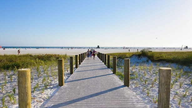 A wooden boardwalk leading to a beach with clear skies. - 5 STAR SIESTA KEY, 80 STEPS to BEACH, LUXURY POOL, 6 BEDROOMS, SPACIOUS LIVING (Siesta Key)