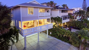 A two-story house with a balcony and a garage. - 5 STAR SIESTA KEY, 80 STEPS to BEACH, LUXURY POOL, 6 BEDROOMS, SPACIOUS LIVING (Siesta Key)