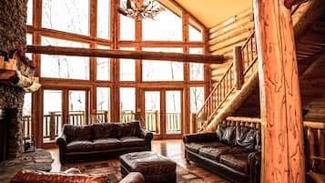 Télévision, cheminée, lecteur de DVD, baby-foot