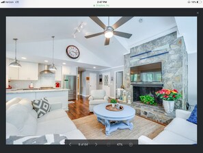 Flat-screen TV, fireplace, ping pong, books