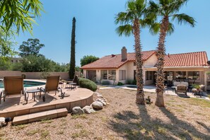 A house with a patio area featuring outdoor furniture and a swimming pool. - PRIVATE CONTEMPORARY HOME WITH BREATHTAKING MOUNTAIN VIEWS (Tucson)