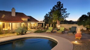 A modern house with a swimming pool, outdoor seating, and a well-maintained garden. - PRIVATE CONTEMPORARY HOME WITH BREATHTAKING MOUNTAIN VIEWS (Tucson)