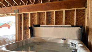 A hot tub with a wooden ceiling and insulation panels. - 12 miles to Yellowstone National Park, hot tub, fire pit, 3 bedrooms 3 bathrooms (Island Park)