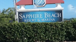 A sign for Sapphire Beach Resort & Marina. - IMMACULATE! WASTE NO TIME GETTING TO THE BEACH! (St. Thomas)