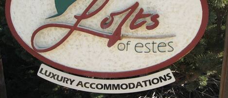 A sign for 'Lofts of Estes' indicating luxury accommodations.