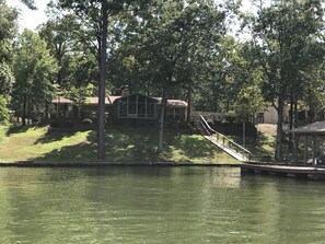 Enjoy serene lakeside views from the large bay window and expansive deck.