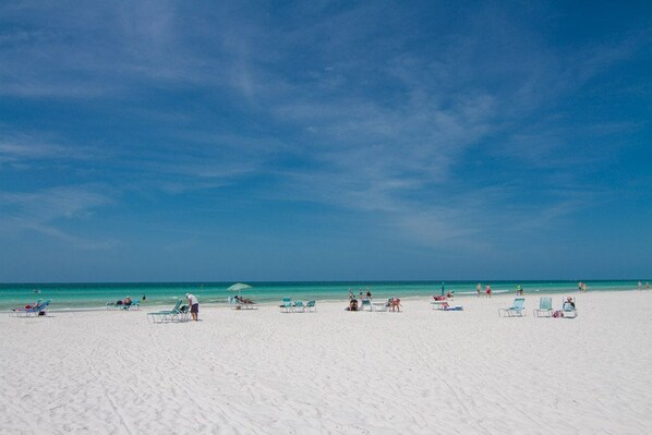 On the beach, sun loungers, beach towels
