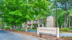 A sign for Villas of Bethany West with a road in front. - Bethany Beach 3-BR Townhouse With Pool and Tennis - Walking Distance to Beach! (Bethany Beach)