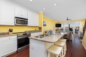 Fridge, dishwasher, coffee/tea maker, cookware/dishes/utensils