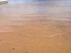 On the beach, sun loungers, beach towels