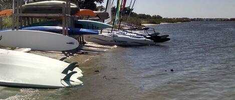 A marina with several sailboats docked.