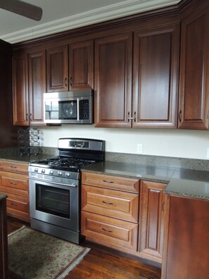 Fridge, microwave, oven, stovetop - 1929 Beautifully Renovated Home 4 Blocks From Ferry to French Quarter (New Orleans)