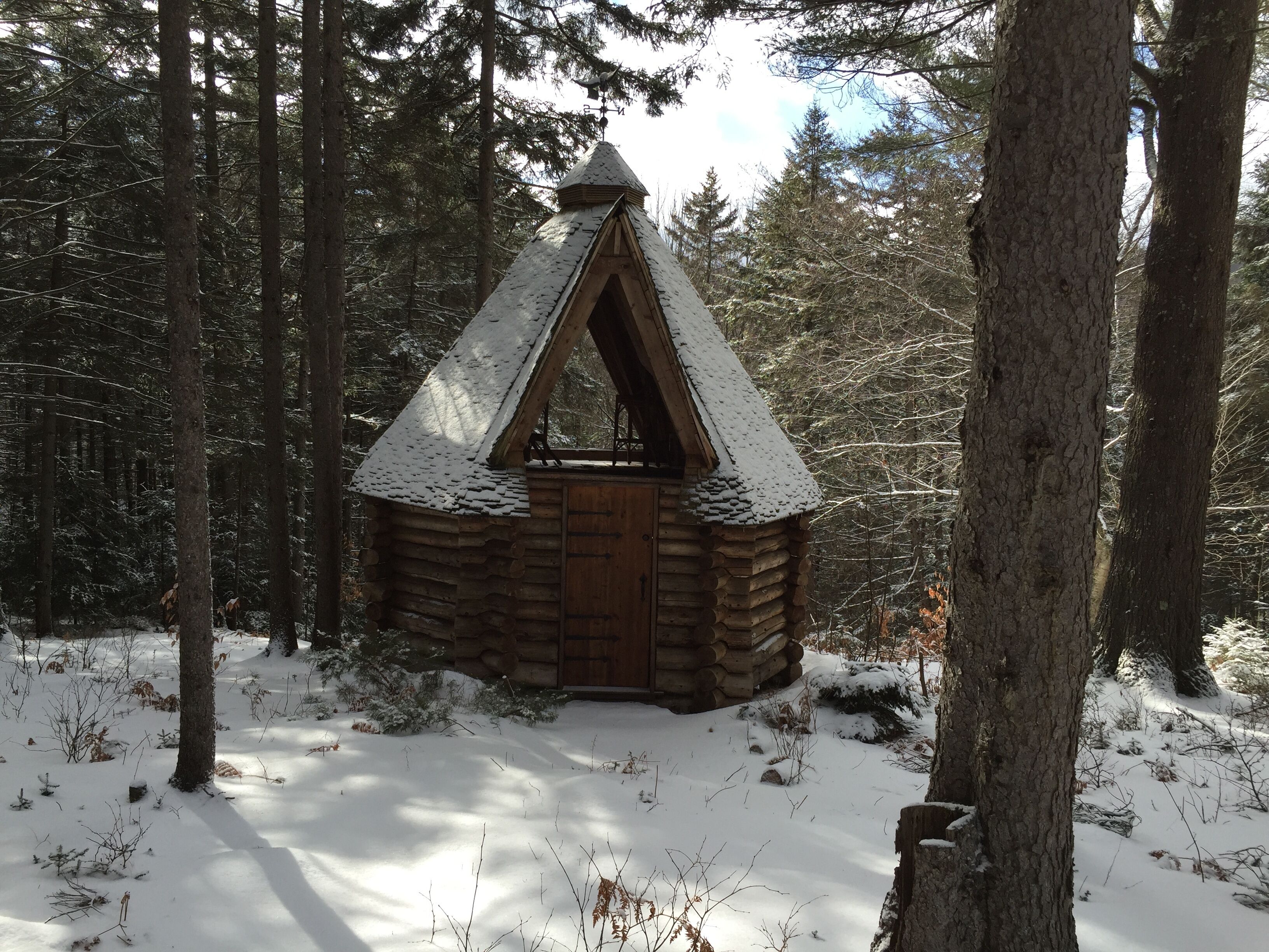 Little cabin in the woods beyond the house just off the right of way.