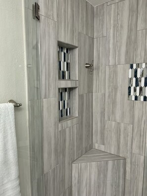 Combined shower/tub, hair dryer, towels, soap