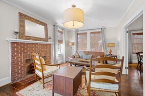 Flat-screen TV, fireplace, books