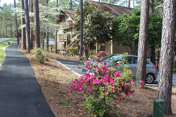 Paved walking path is steps from the door and leads to The Club and beyond.