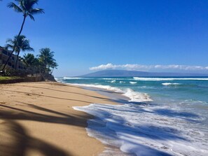 On the beach, sun-loungers, beach towels