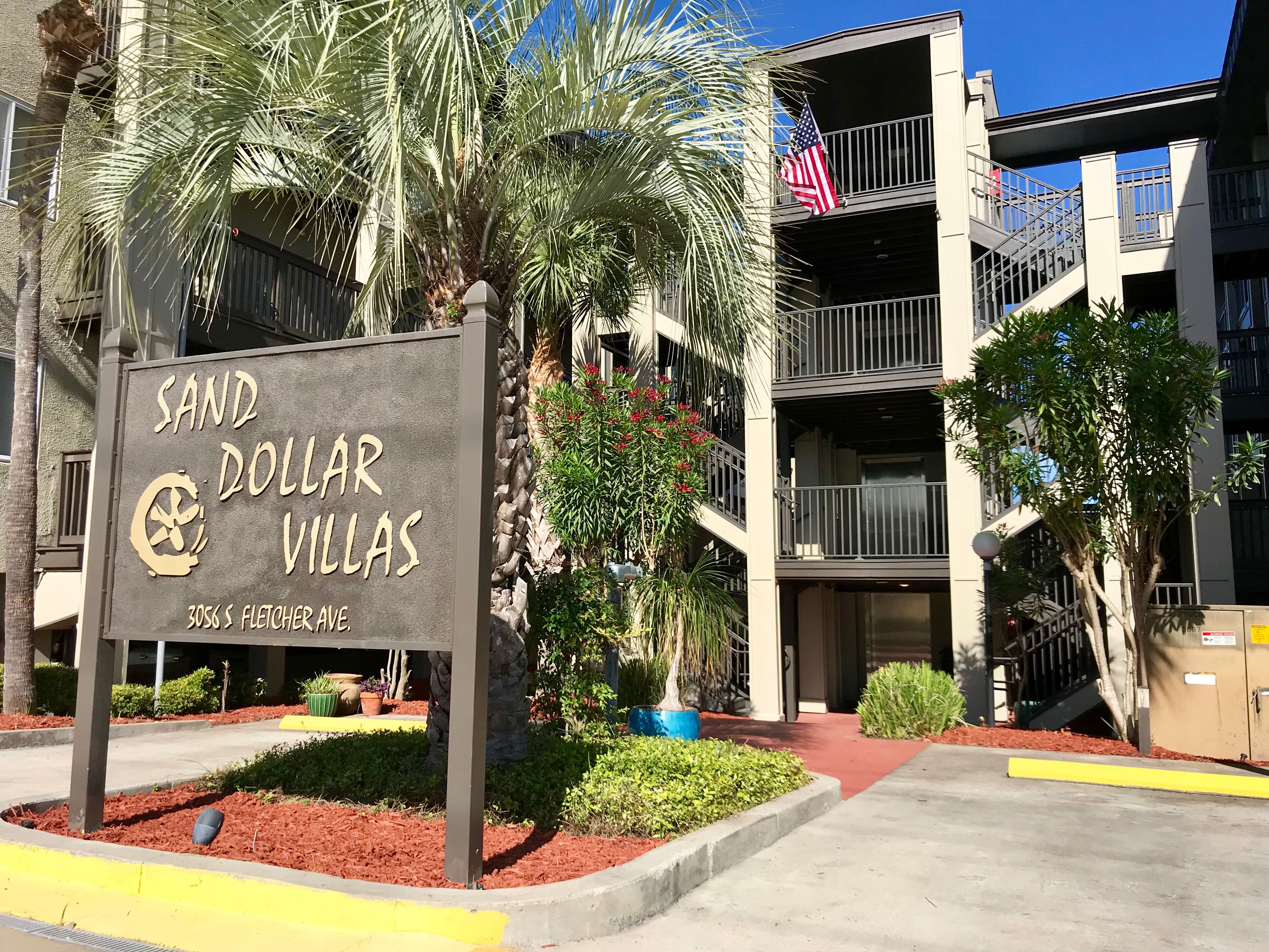A sign for 'Sand Dollar Villas' at 3035 S Fletcher Ave.