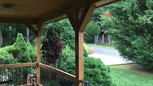 A wooden deck with a railing, potted plants, and a bench. - Your Mayberry Get-a-Way Cabin- Only 6 miles from Downtown Mount Airy (Mount Airy)