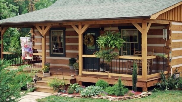 A log cabin with a porch, number 305, surrounded by a garden. - Your Mayberry Get-a-Way Cabin- Only 6 miles from Downtown Mount Airy (Mount Airy)
