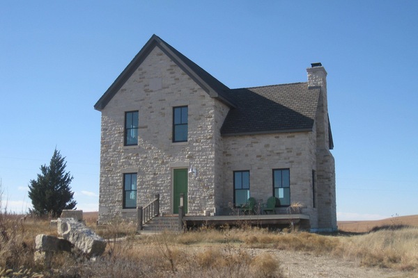 True Prairie Home, nestled in the Flint Hills, surrounded by a sea of grass.