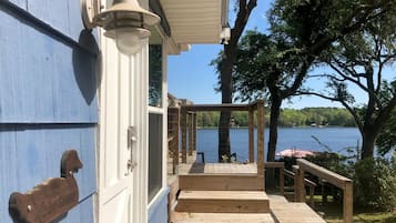 Step out onto the deck and enjoy a tranquil lakeside view from the covered porch.