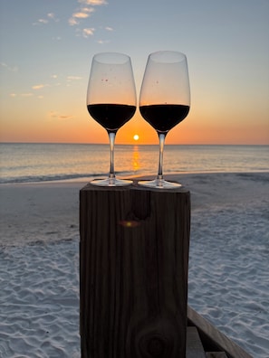 Two wine glasses on a wooden post by the beach at sunset. - BEST DEAL ON THE CAPE.  200 STEPS TO THE BEACH, NOT A 6 MIN DRIVE.  PETS OK. (Port St. Joe)