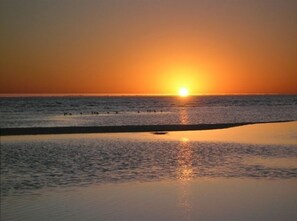 Enjoy a serene beach experience with gentle waves and breathtaking views.