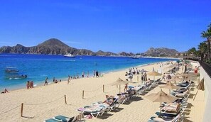 On the beach, sun loungers, beach towels
