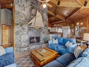 Televisión, chimenea, libros y oficina