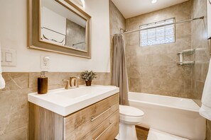 Bathtub, hair dryer, towels, soap