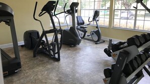 A gym with treadmills, elliptical machines, and weight benches. - Look at This! Fun in the Sun for Everyone! (Kissimmee)