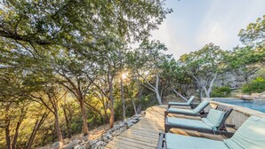 A wooden deck with lounge chairs and a pool. - Resort Quality 4B Home With Private Pool In Beautiful Hill Country (New Braunfels)