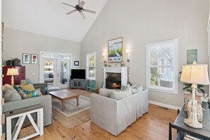 Smart TV, fireplace, books, stereo