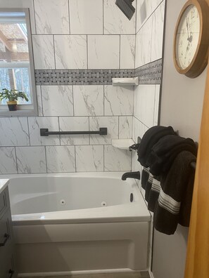 Combined shower/tub, hair dryer, towels, soap