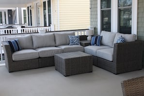Relax on the porch with a comfortable sectional sofa and matching ottoman.