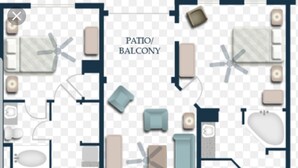 Un plan d’étage d’hôtel comprenant une terrasse ou un balcon, plusieurs chambres, une cuisine et un coin repas.