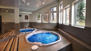 A spa area with two hot tubs, a wooden floor, and large windows. - 2 BR Updated Condo-Mountain View! Excellent location, views & value! (Breckenridge)