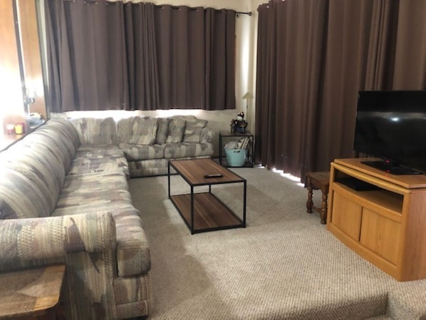 Large living area, kitchen bar seating overlooks into living room