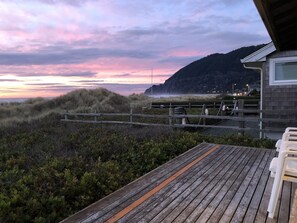 A wooden deck with a view of the beach and a mountain. - Manzanita-Old Time Beach Front Simplicity. Come And Relax. MCA 316 (Manzanita)