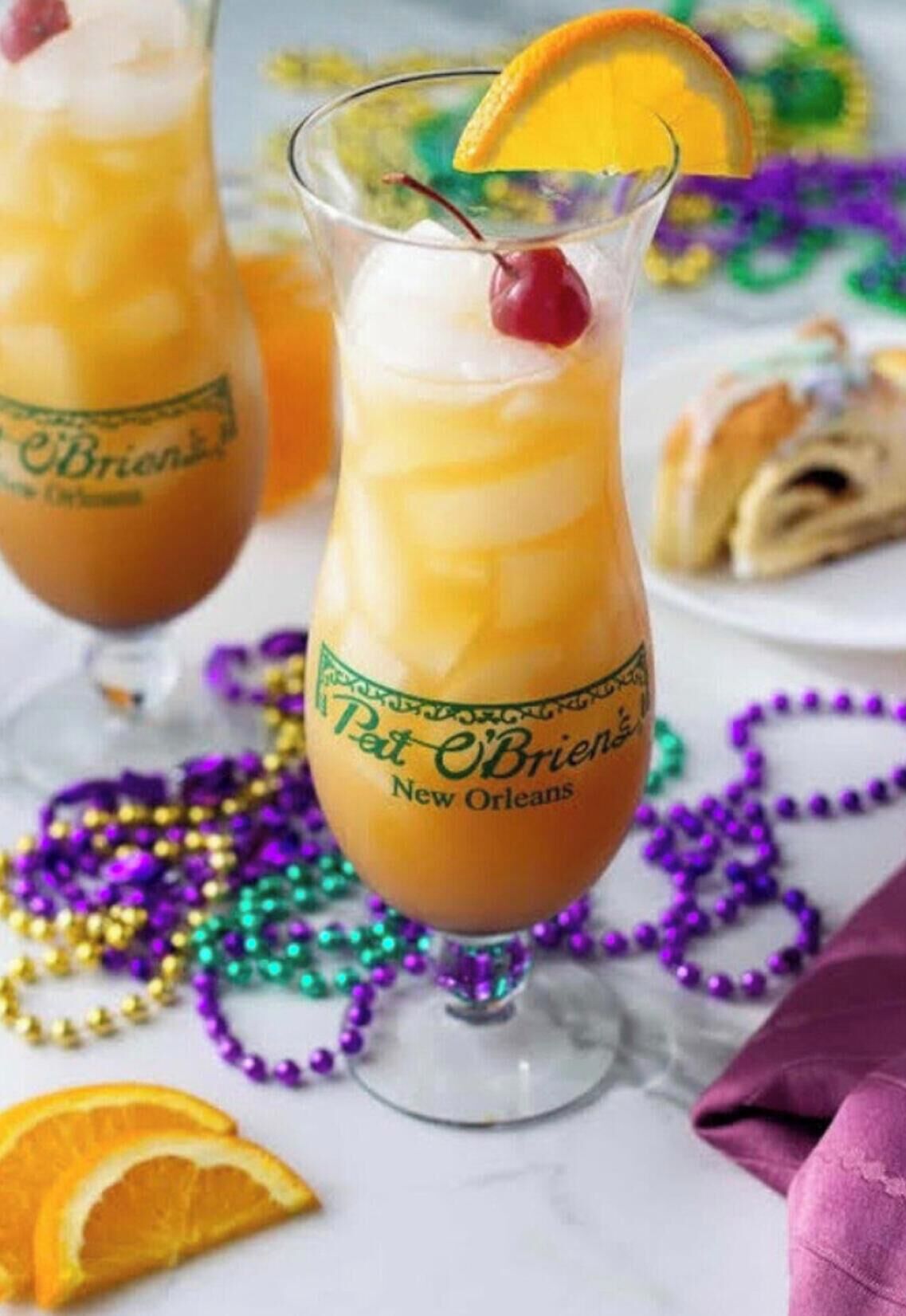Two cocktails in glasses with a label reading 'Pat O'Brien's New Orleans.'