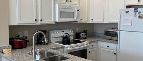 Coffee/tea maker, fridge, microwave, oven