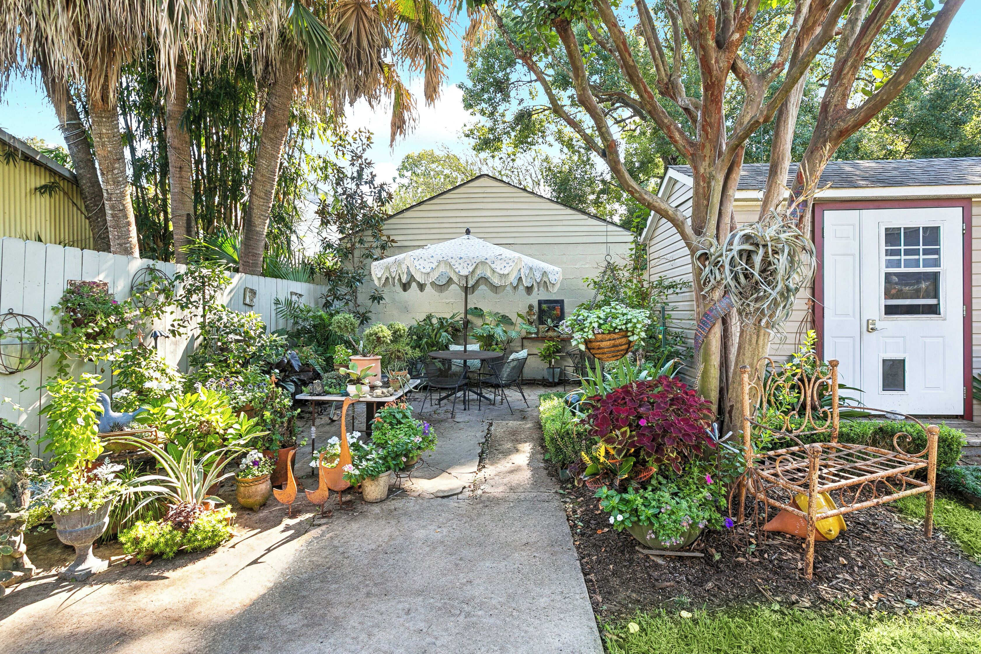 Garden view with shared seating and a barbecue