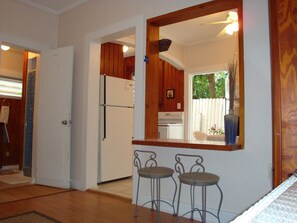 A kitchen with a refrigerator, stove, and two bar stools. - Special @109.lodg. 9-14 to 10-7
With 4 night stay 4th night FREE
lodging!




   (Key West)